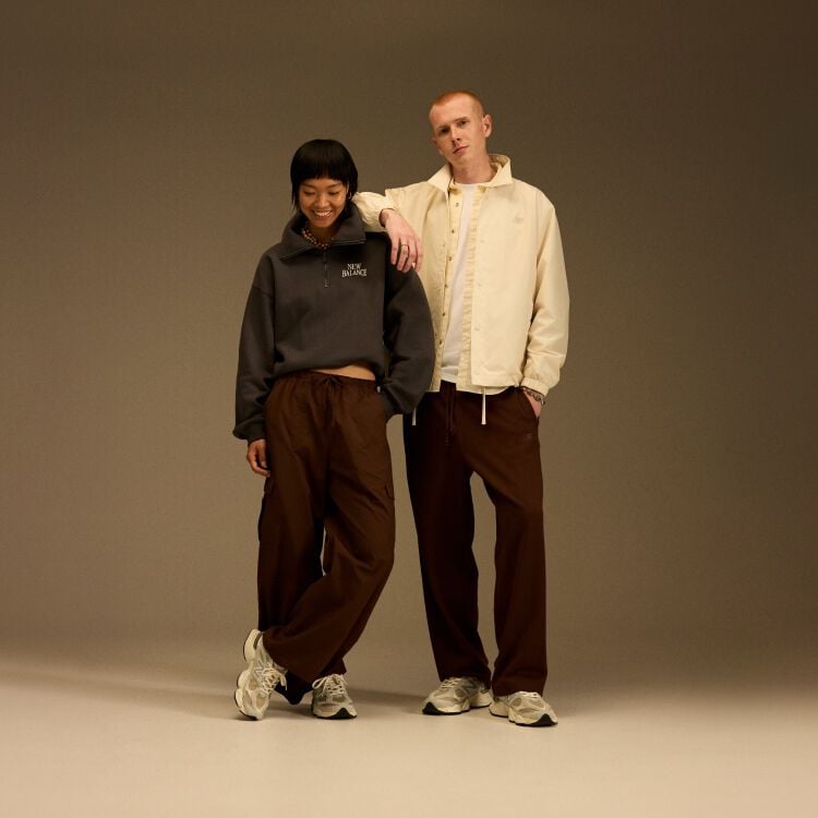 On-figure / head to toe shot of the 9060s being modeled by a man and a woman.